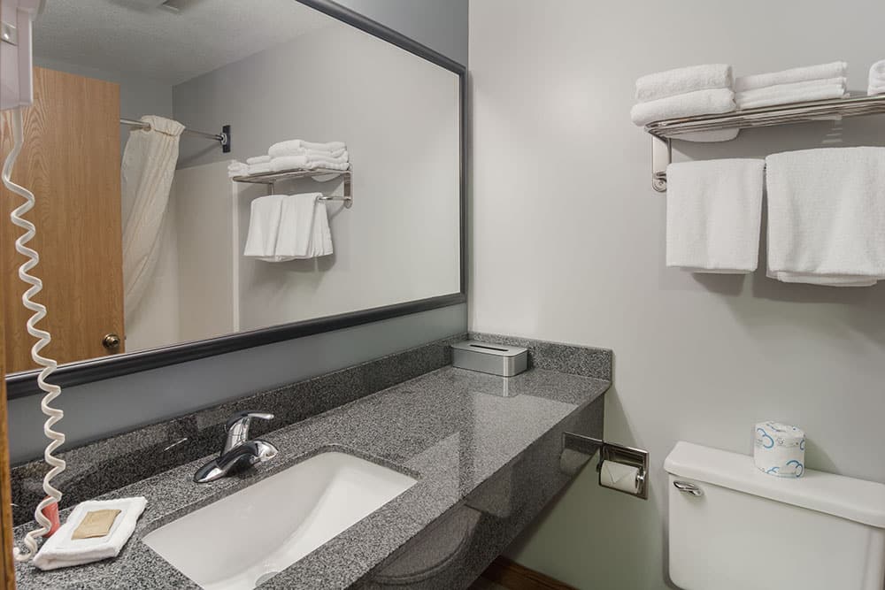 guest room bathroom at a boarders inn and suites